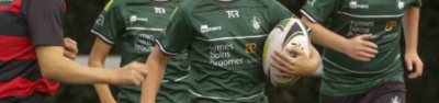 Rugby players with Symes Bains Broomer's logo on their uniform as part of their sponsorship