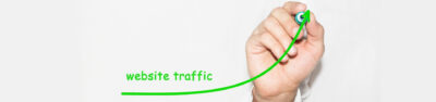 man drawing an upwards curve in green showing website traffic
