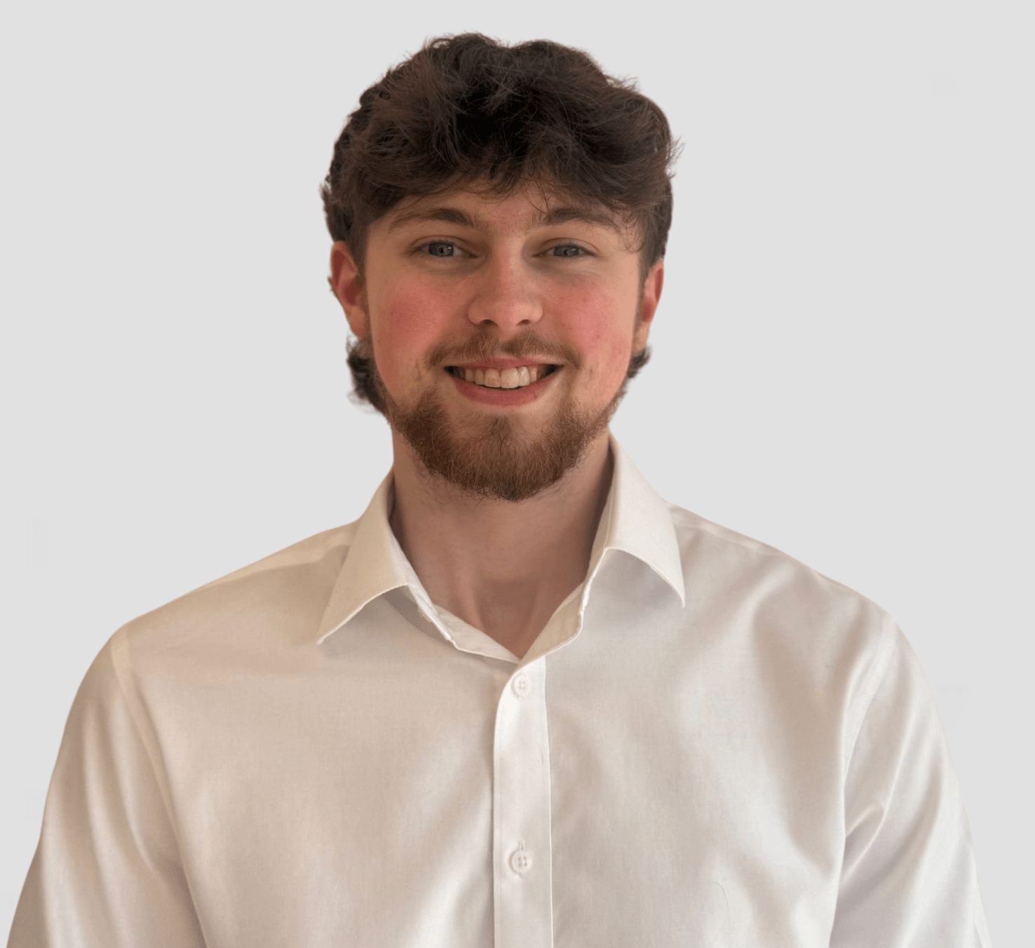 man headshot in a white suit